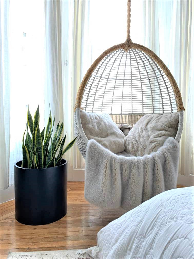 Black Brea Round Cylinder Fiberglass Planter by the Window
